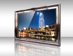 Thumbnail of framed mirror TV showing cityscape at night with a tall building and water reflections.